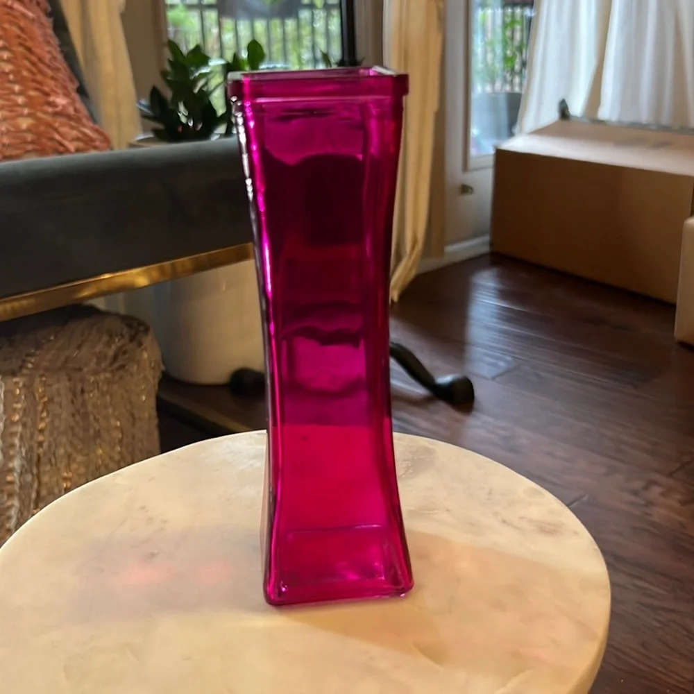 Pink glass narrow 7.5” tall 2.25” wide at widest part top & bottom, 1.75” middle